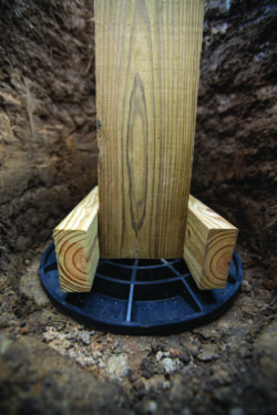 FootingPad with uplift resistance cleats on wood post