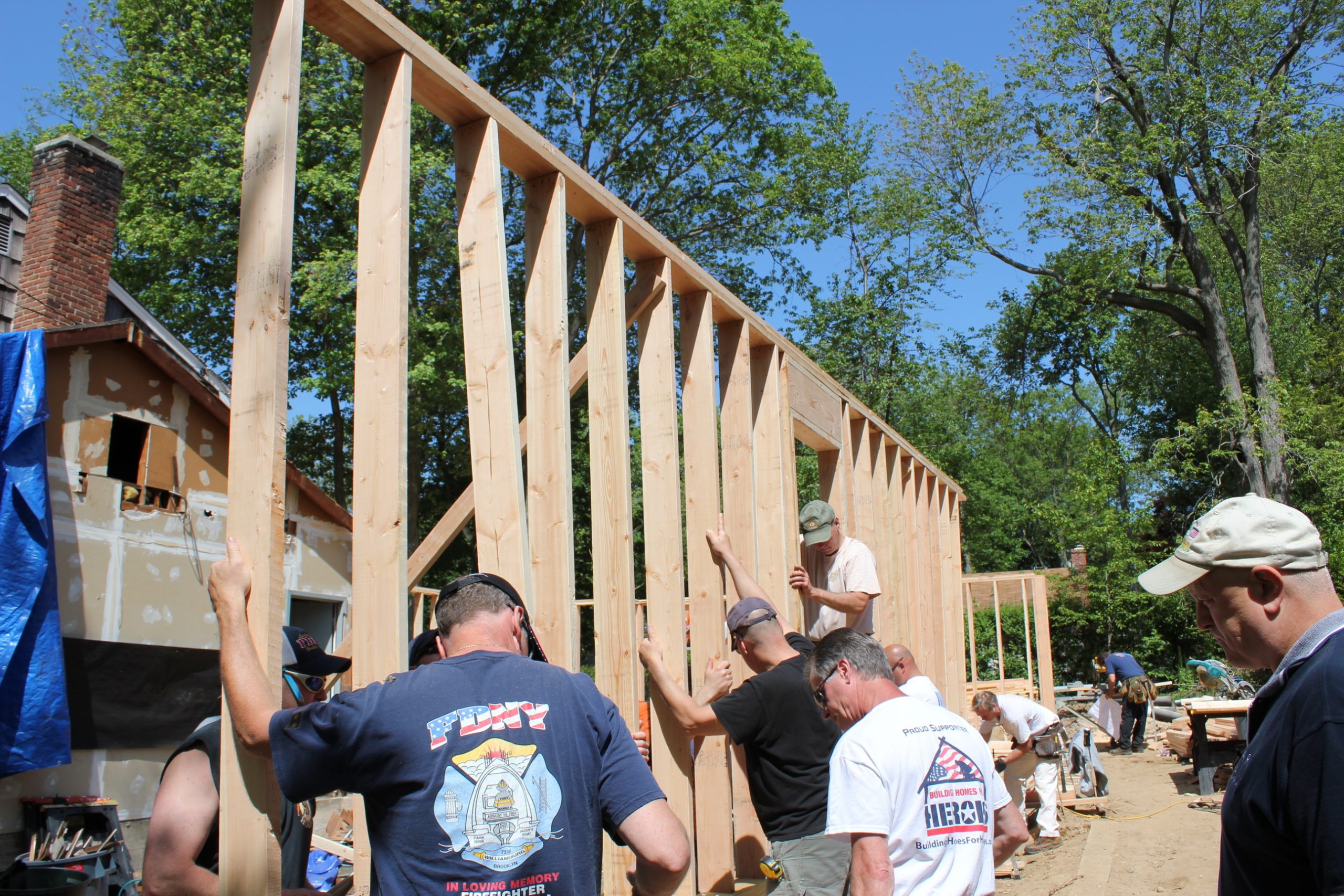 volunteers working on house