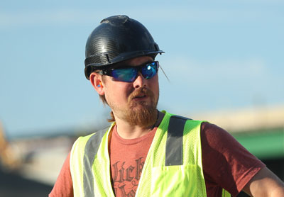 Hard hat worn by worker.